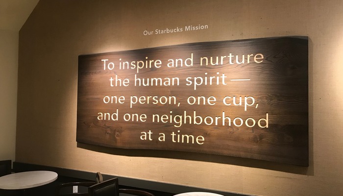 Wall carving of Starbucks' mission statement in one of their coffee houses