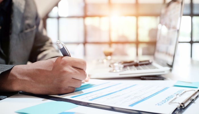 Business owner filling out insurance form