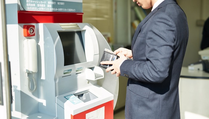 Person using ATM in Japan