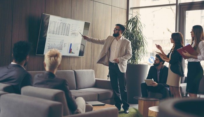 Startup CEO delivering presentation to staff
