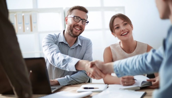 Businessman shaking hands with colleague and business partner