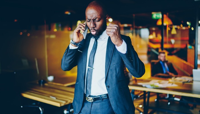 Angry boss shouting on phone
