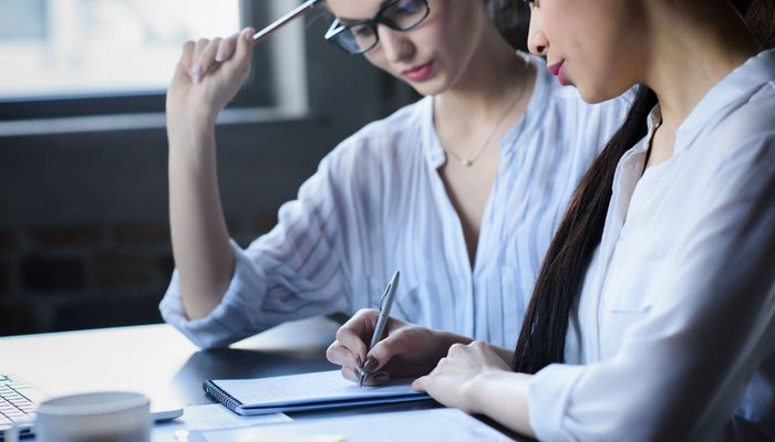 Businesswomen looking at a business plan