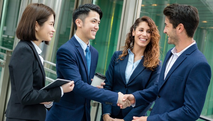 Two business parties congratulating each other on a deal
